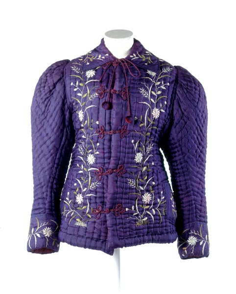 Purple quilted jacket with leg of mutton sleeves, floral embroidery and frogging.