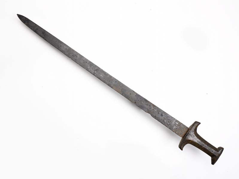 Long, sword-like dagger called a baselard, with a wooden handle.