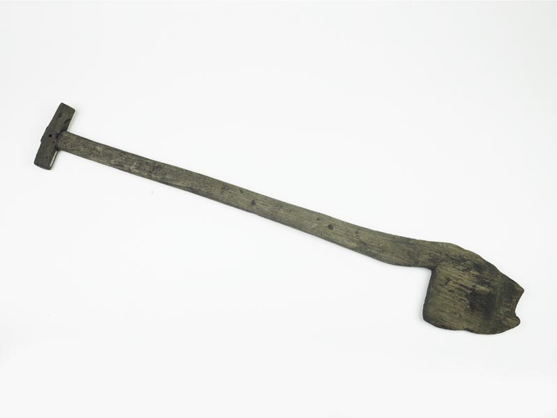 Wooden spade. The iron 'shoe' from the blade is missing.