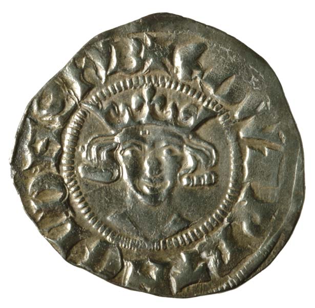 Coin with head of Edward II.  The edges are worn away, but writing is visible here.